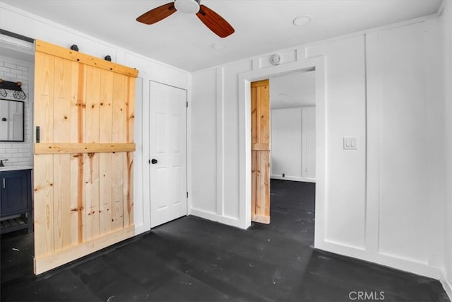 interior space with ceiling fan