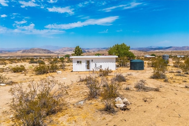 back of property with a mountain view