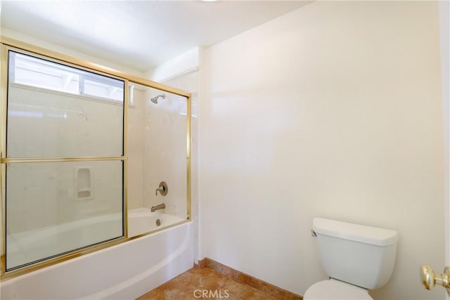 bathroom with tile patterned floors, toilet, and enclosed tub / shower combo