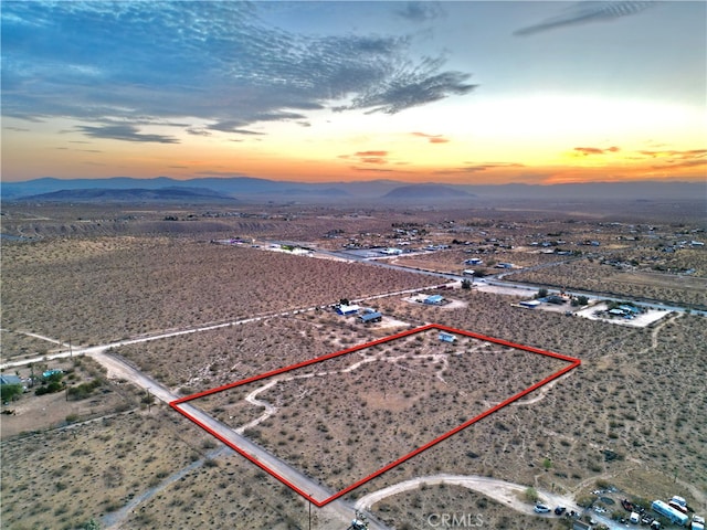 aerial view at dusk with a mountain view