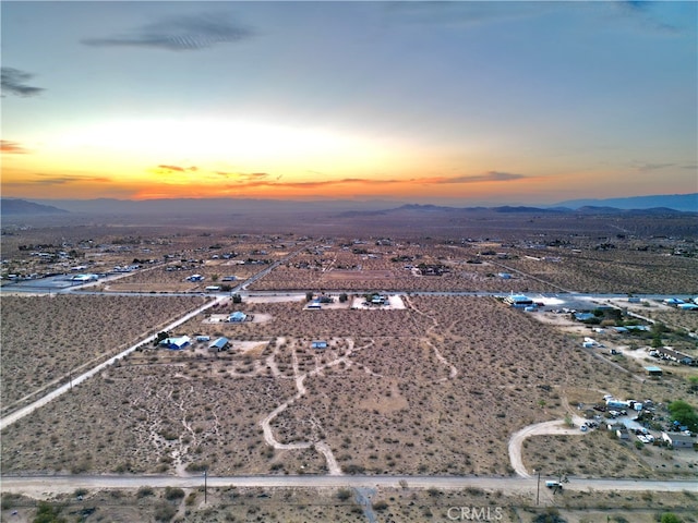 aerial view at dusk with a mountain view