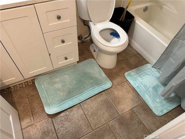 bathroom featuring toilet and a bathing tub