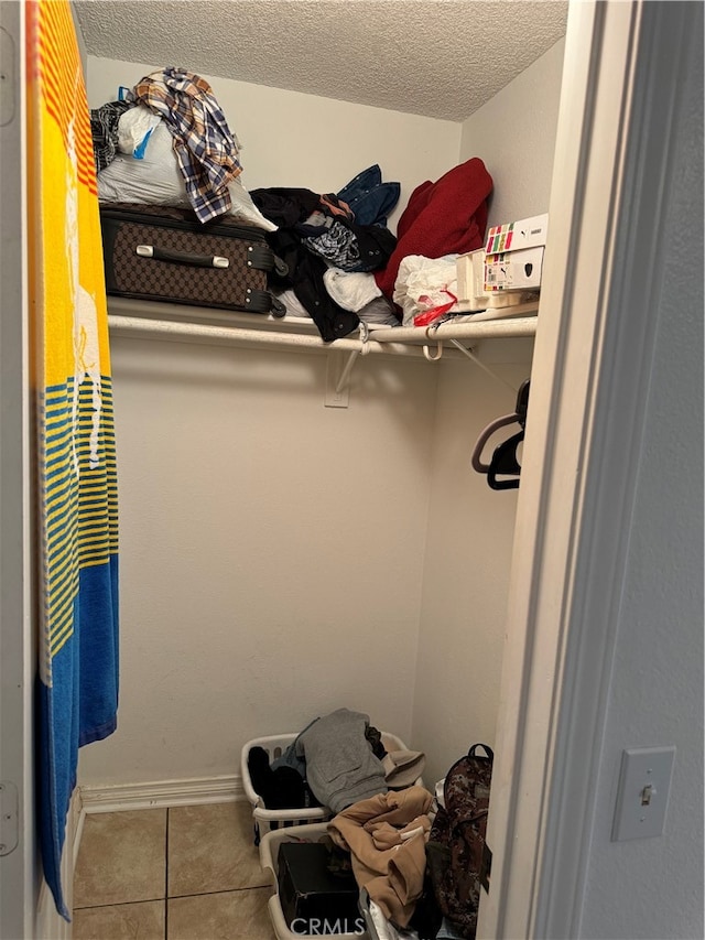 spacious closet featuring tile patterned floors