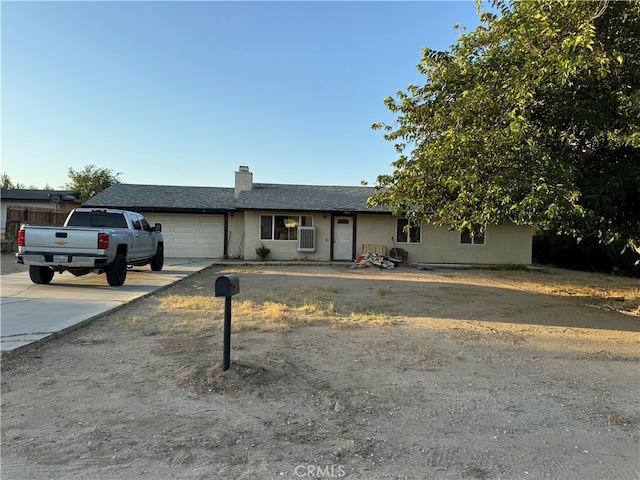 ranch-style home with a garage