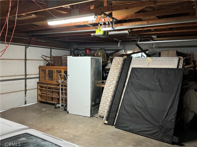 garage featuring white fridge