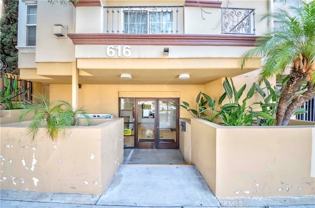 view of exterior entry featuring french doors