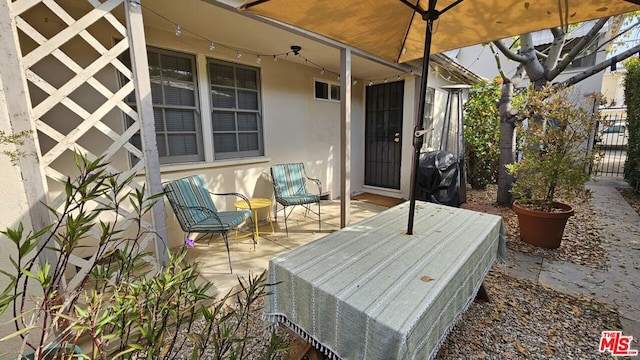 view of patio featuring a grill