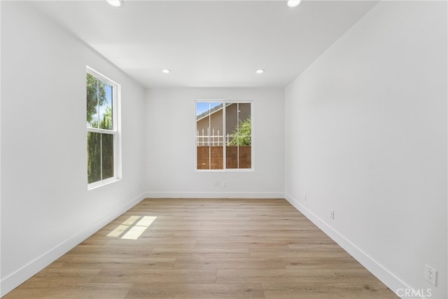 unfurnished room featuring light hardwood / wood-style flooring