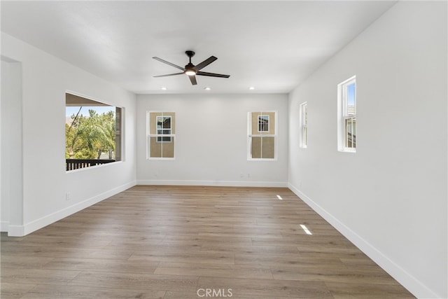 unfurnished room with light hardwood / wood-style flooring and ceiling fan