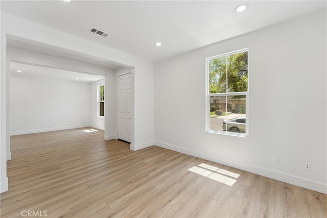 spare room featuring light hardwood / wood-style floors