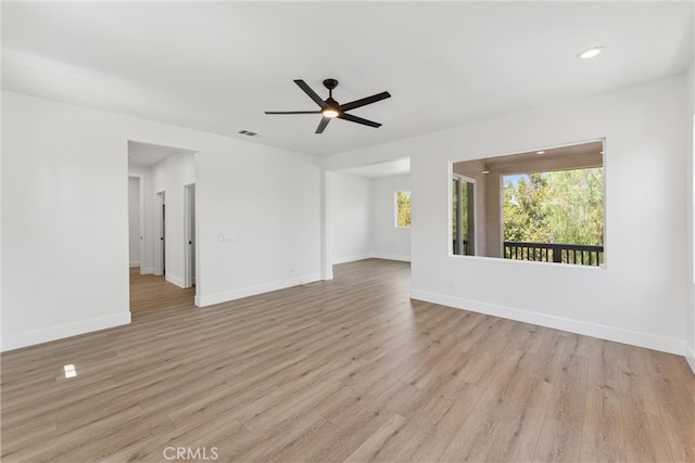 unfurnished room featuring ceiling fan and light hardwood / wood-style flooring