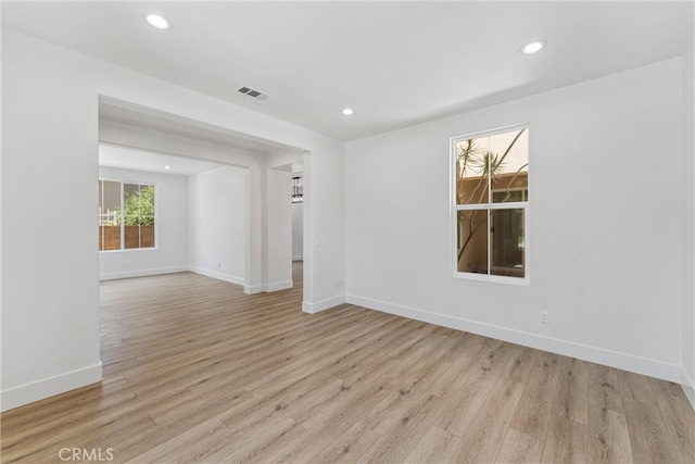 unfurnished room featuring light wood-type flooring