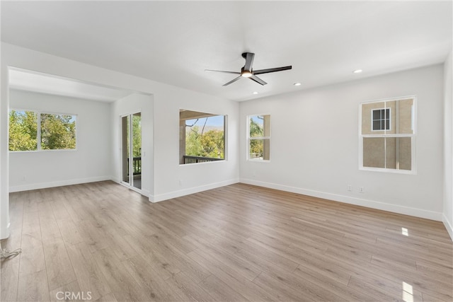 unfurnished living room featuring ceiling fan and light wood-type flooring