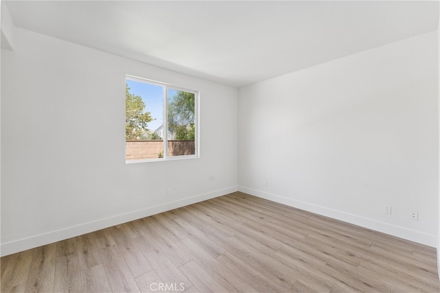 unfurnished room with light hardwood / wood-style floors