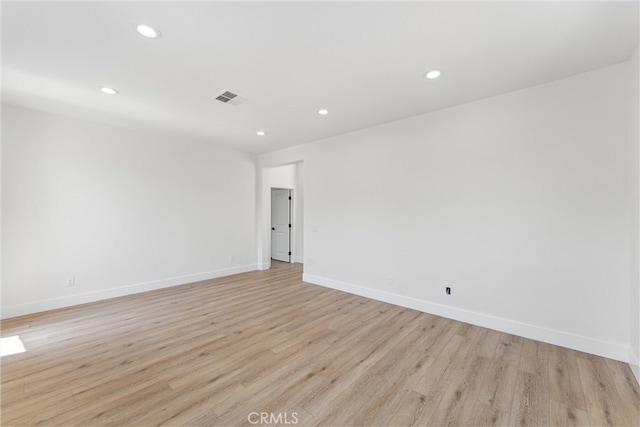 unfurnished room featuring light wood-type flooring