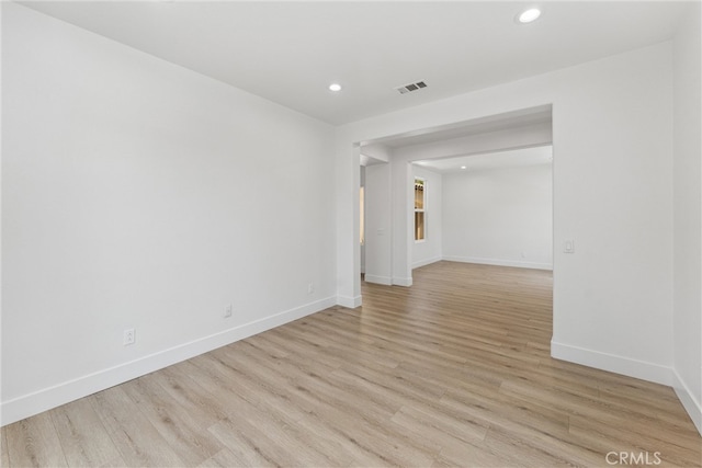 spare room featuring light hardwood / wood-style flooring