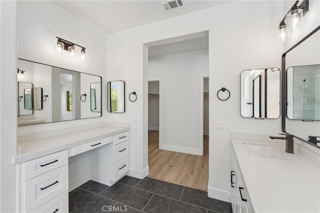 bathroom with wood-type flooring and vanity