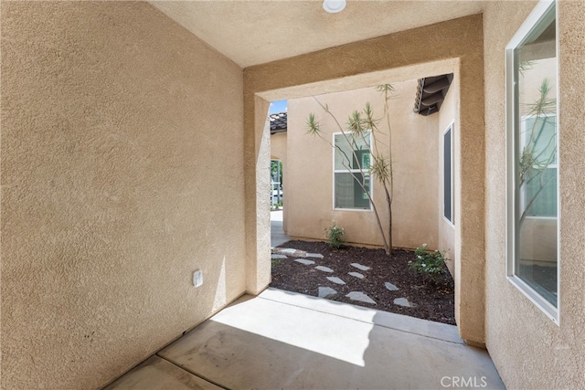 property entrance featuring a patio area