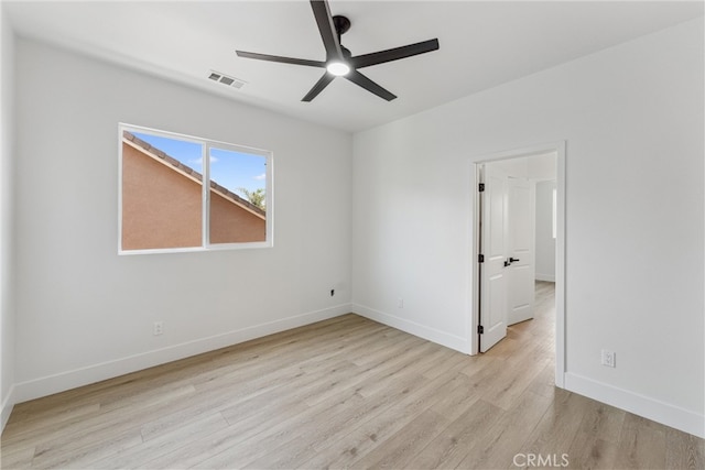 empty room with light hardwood / wood-style floors and ceiling fan