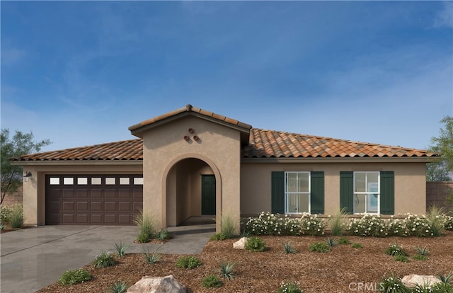 mediterranean / spanish home featuring a garage