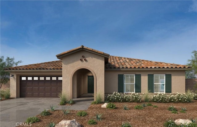 930 Thunder Trl, San Jacinto, CA 92582 - mediterranean / spanish-style home featuring concrete driveway, an attached garage, a tiled roof, and stucco siding