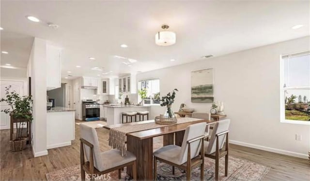 dining room featuring light wood-type flooring