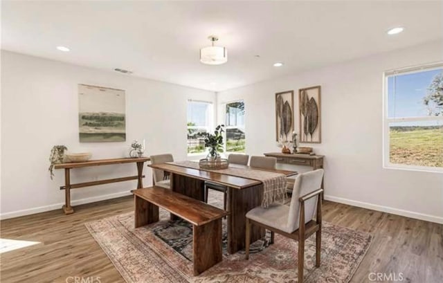 dining room with wood-type flooring