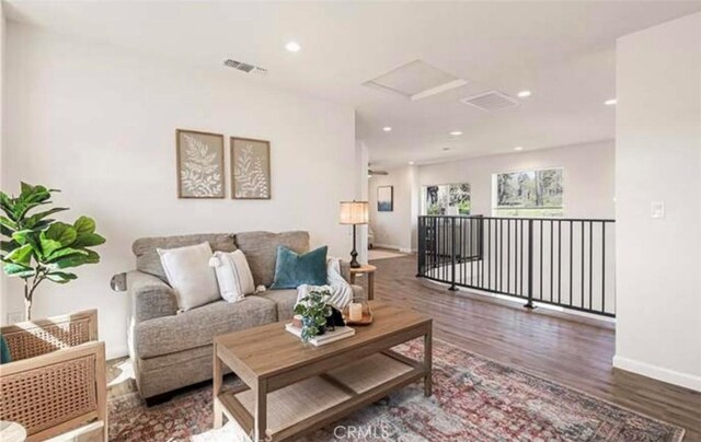 living room featuring dark hardwood / wood-style flooring