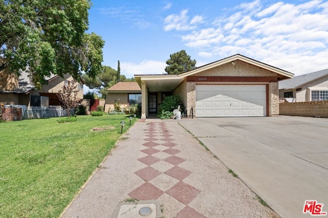 ranch-style house featuring a garage and a front yard