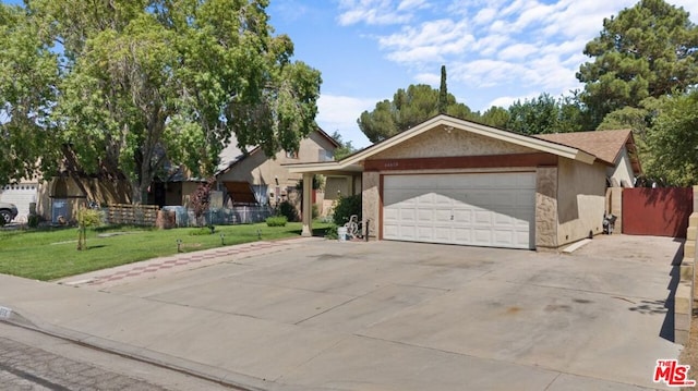 ranch-style home featuring a garage and a front lawn