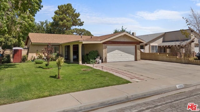 ranch-style house featuring a front lawn and a garage