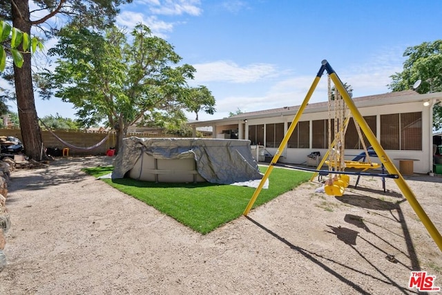 exterior space with a swimming pool