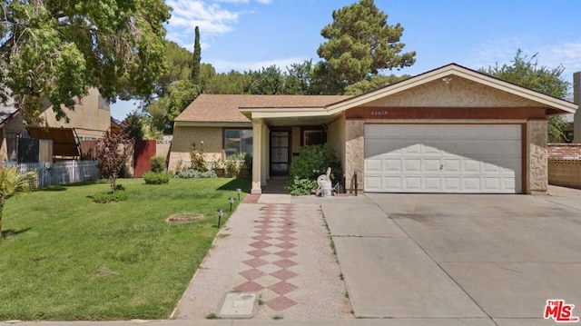 single story home with a garage and a front yard