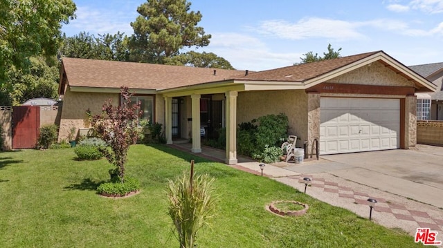 single story home featuring a garage and a front lawn