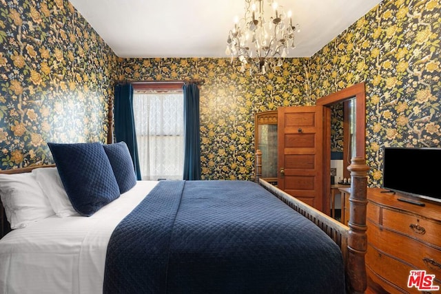 bedroom featuring an inviting chandelier