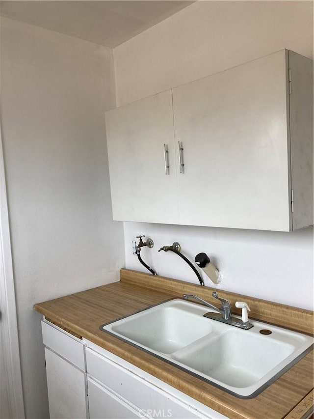 kitchen with sink and white cabinets