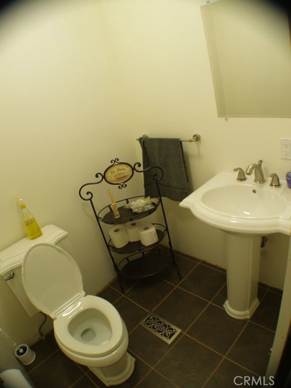 7003 Pioneer Dr, Grizzly Flats, CA 95636 - bathroom with tile patterned flooring and toilet