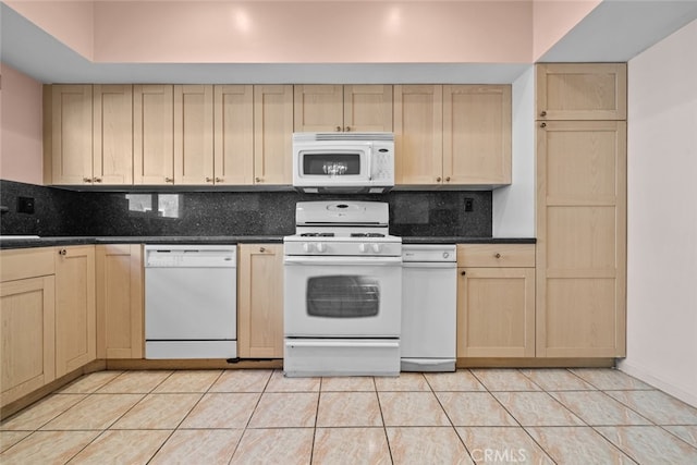 kitchen with white appliances, light brown cabinets, light tile patterned floors, and tasteful backsplash