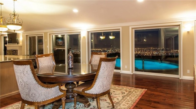 dining space with dark hardwood / wood-style flooring