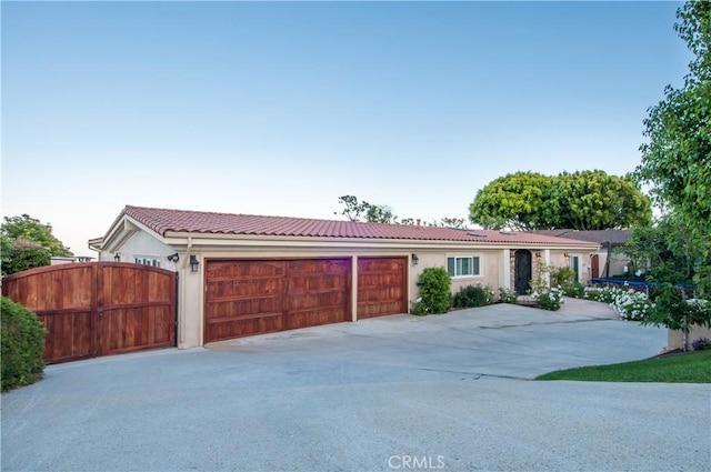 ranch-style home featuring a garage