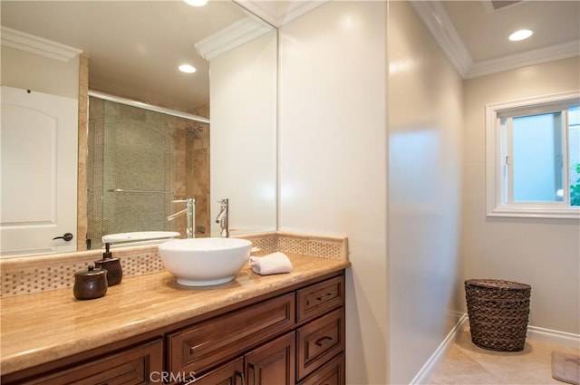 bathroom featuring vanity, tile patterned flooring, a shower with shower door, and ornamental molding