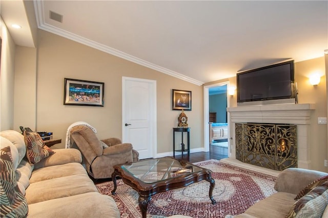 living room featuring vaulted ceiling, ornamental molding, and wood-type flooring