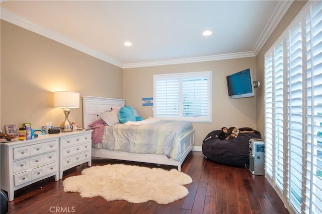 bedroom featuring crown molding and dark hardwood / wood-style flooring