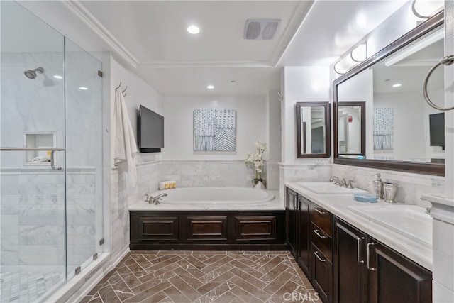 bathroom featuring vanity and separate shower and tub