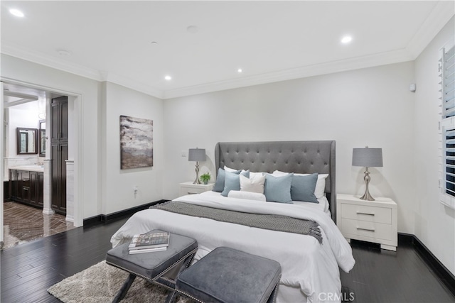 bedroom featuring ornamental molding, dark hardwood / wood-style floors, and ensuite bathroom