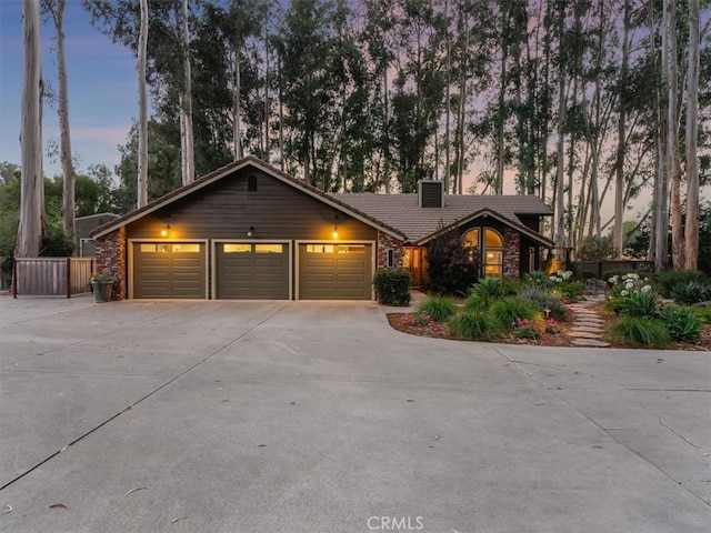 ranch-style house featuring a garage