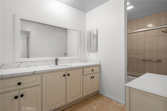 bathroom featuring vanity, tile patterned floors, and tiled shower / bath combo