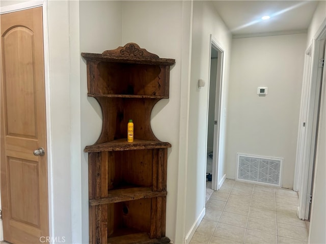 hallway with light tile patterned floors