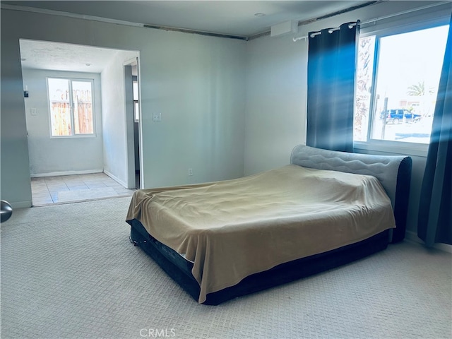 bedroom with light colored carpet