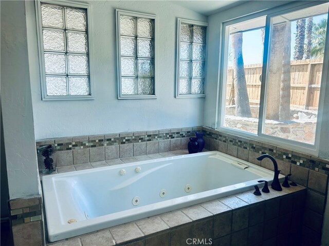 bathroom featuring tiled bath